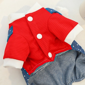 Close-up of pet jumpsuit featuring red waffle texture and blue polka dot patterns