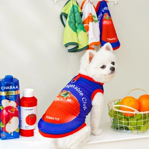 Breathable summer pet vest featuring tomato prints on a small dog with fruit props