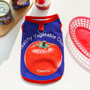 Close-up of blue mesh dog vest with tomato print and metal D-ring for leash attachment