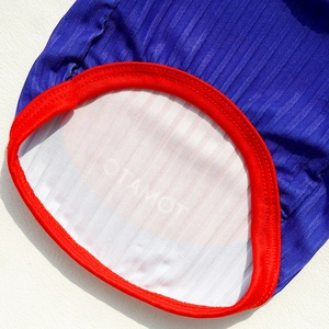 Close-up of pet vest ribbed knit neckline with red trim and high-quality stitching