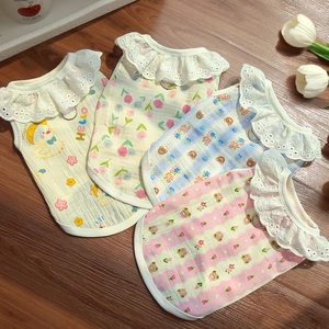 Detail of breathable cotton pet vests with lace collars and metal D-rings for leashes