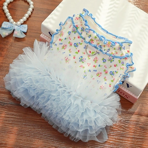 Detail of floral pet dress with light blue mesh skirt and metal D-ring for leash attachment