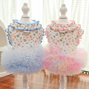 Detail of floral pet summer dresses in blue and pink with lace trim and mesh skirts