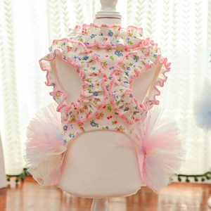 Close-up of floral pet dress showing pink ruffle edges and layered mesh tutu skirt detail