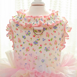 Close-up of pet floral harness dress with metal D-ring and ruffled organza skirt details
