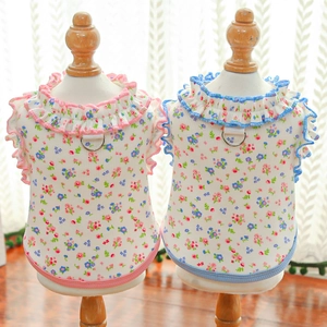 Close-up of floral pet vests with ruffle collar and metal D-ring for leash attachment