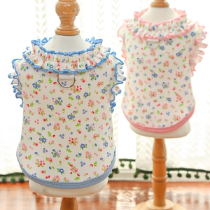 Close-up of floral pet vest with ruffled collar and metal D-ring for leash attachment