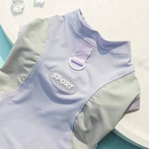 Close-up of a breathable purple mesh dog vest featuring a durable D-ring and sport logo