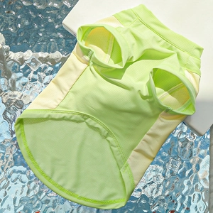 Close-up of breathable mesh pet cooling vest in neon green and yellow for summer