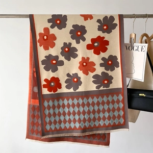 Floral pashmina shawl with orange blossoms and geometric blue accents with tassels