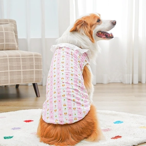 Detail of pink striped cotton dog vest with lace collar and cute bear floral patterns