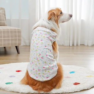Detail of floral print dog vest with lace trim on breathable cotton fabric for pets