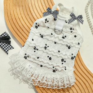 Detailed layered lace pet dress with black floral patterns and dual bow accents