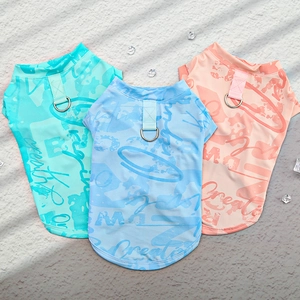 Close-up of breathable mesh dog vests in mint green, sky blue, and coral pink colors
