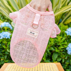 Pink lace pet vest detail with 'Beauty' patch and metal D-ring for leash attachment