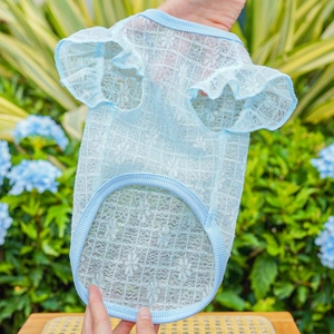 Detail of light blue pet lace shirt with floral mesh and ruffle sleeves for dogs