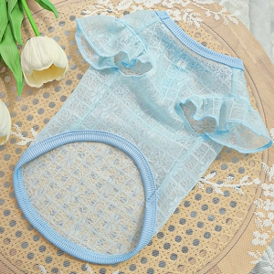 Close-up of light blue lace pet vest with ruffle sleeves and size S label on tray