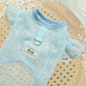 Detail of light blue pet lace dress with Beauty patch and metal D-ring for leash attachment