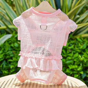 Detail view of pink pet lace dress with reinforced metal D-ring for leash attachment