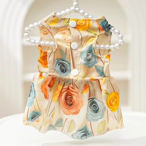 Detail of 3D rose floral pet dress with back buttons and pleated hem on pearl hanger