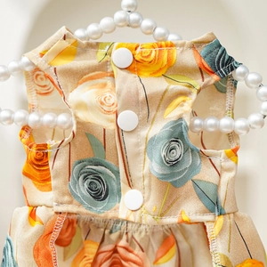 Detail of 3D rose print pet dress with white buttons and elegant pearl hanger