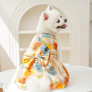 Detail of floral pet dress with orange 3D rose pattern and metal D-ring for leash