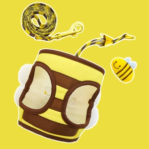 Detail of bee-themed cat harness set featuring breathable mesh and cute plush bee pendant