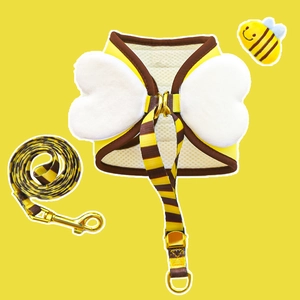 Detail of bee pet harness with plush wings and matching striped leash for small dogs