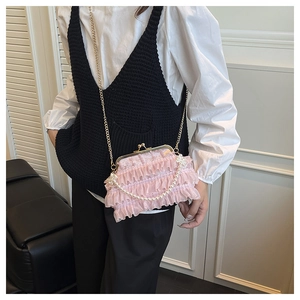 Pink lace crossbody bag with layered ruffles, pearl chain, and vintage metal clasp