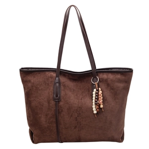 Brown faux suede tote bag with checkered texture and ethnic beaded tassel charm