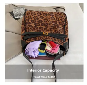 Internal capacity of leopard print bucket bag with daily items and golden metal buckle