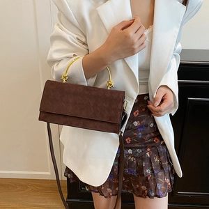 Brown suede crossbody bag with woven texture and gold metal handle for women