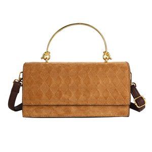 Brown quilted faux suede handbag with gold metal handle and adjustable leather strap
