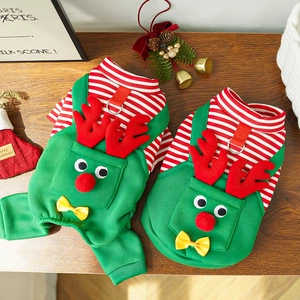 Close-up of reindeer-themed Christmas pet apparel with 3D antlers on wood background