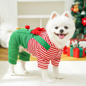 Detail of Christmas pet jumpsuit with reindeer antlers on a white Pomeranian dog