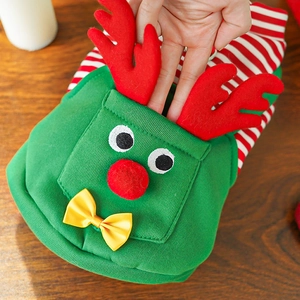 Close-up of green Christmas dog sweater with 3D reindeer antlers and striped sleeves