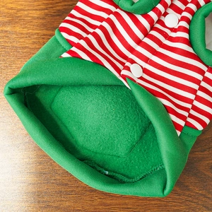 Detail view of striped Christmas pet vest featuring soft fleece lining and white snap buttons