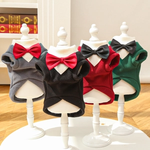 Detail of pet suit formal tuxedos with elegant bow ties and stylish swallowtail cut design