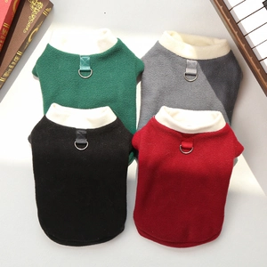 Detailed view of colorful fleece pet vests with high necks and metal D-ring leash attachments