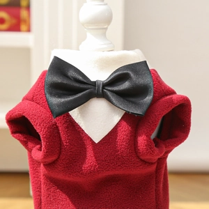 Detailed close-up of a red fleece pet formal suit featuring a black bow tie and white collar