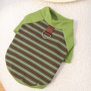 Detail of green and brown striped dog vest with a metal D-ring for leash attachment