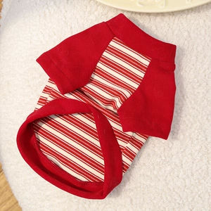 Close-up of red and white striped cotton pet t-shirt on a soft white plush background