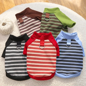 Flat lay of striped dog sweatshirts in five colors with metal D-rings on soft rug
