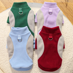 Fleece pet vest with D-ring harness in green, purple, blue and red on white fur background