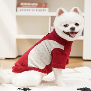 Close-up of warm fleece pet sweatshirt with red and grey patchwork and high neck windproof design