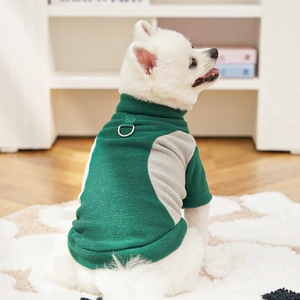 Detail of green fleece dog vest with built-in metal D-ring for leash attachment