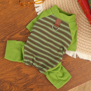 Detail of green striped pet pajamas featuring a metal D-ring for leash attachment