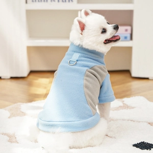 Close-up of blue and gray fleece pet vest with metal D-ring for leash attachment