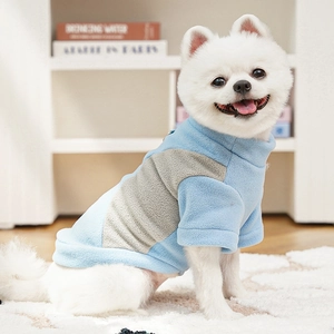 Detail of blue and grey fleece pet sweatshirt with soft texture and warm high collar