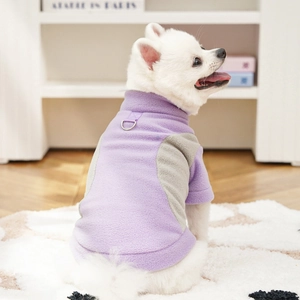 Detail of fleece pet coat featuring a metal D-ring for leash attachment on dog sweater